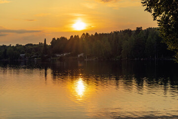 Reflecting sunset light on lake in Sweden