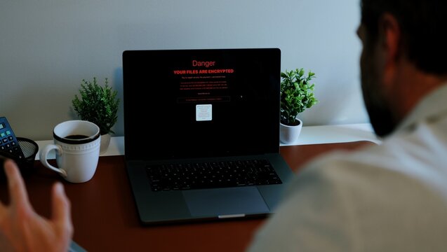 Middle Aged Executive Man Working From Home Falls Victim to Spear Phishing Ransomware Attack - Common Cybersecurity Scenario Concept - Powered by Adobe