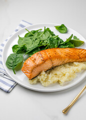 Baked salmon with mash potato and spinach