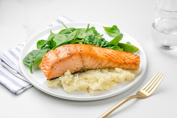 Baked salmon with mash potato and spinach