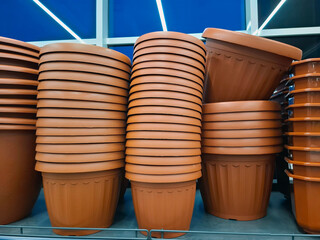 Large brown flower pots on supermarket shelves