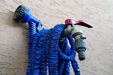 Outdoor tap for watering a garden plot. Water tap outside the building