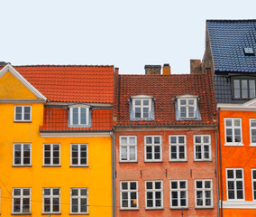 Row of colorful old historic town houses - apartment buildings.