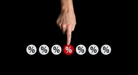 Hand pointing at highlighted percentage symbol on black background  