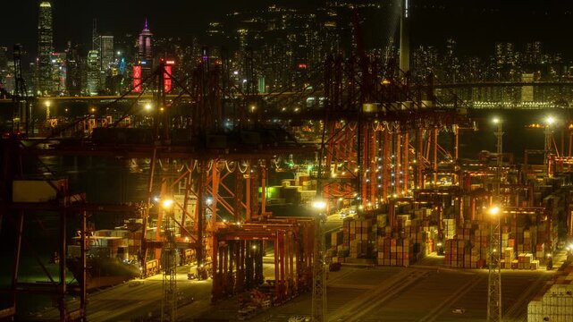 Large buzy container cargo freight ship terminal at night in Hong kong, China, time lapse, 4k
