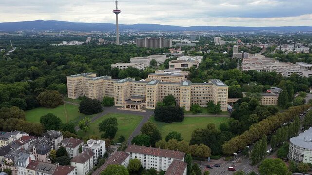 Impressive aerial shot showcasing iconic architecture of Goethe University Westend Campus with the Europaturm in the background
