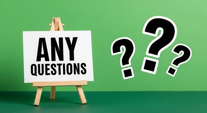 Any questions sign displayed on easel with green background