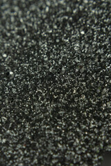 close-up of a sparkling silver glitter texture, abstract festive background with shimmering tiny particles and shallow depth of field, concept of holidays, new year,xmas, celebrations, christmas.