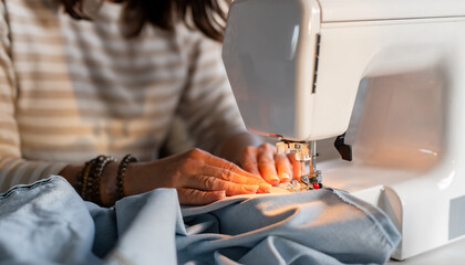 Woman'S Hands Sewing On Machine