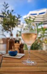 Rose wine at a waterfront restaurant with bright blue skies in Nice, France