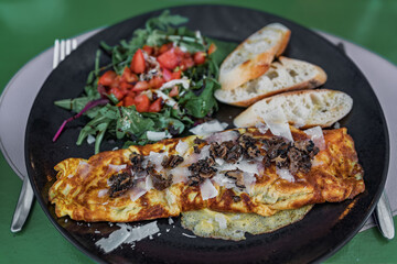 A truffle omelet with a salad and toast at a restaurant in Nice, South of France