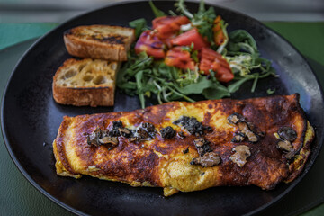 A truffle omelet with a salad and toast at a restaurant in Nice, South of France