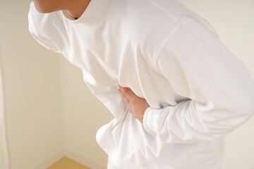 A middle-aged man suffering from stomach pain