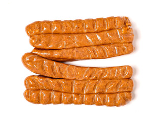 A row of top quality hot dogs are sitting on a white background. The hot dogs are covered in a brown glaze and are arranged in a neat row. Simple product made to highest standard.