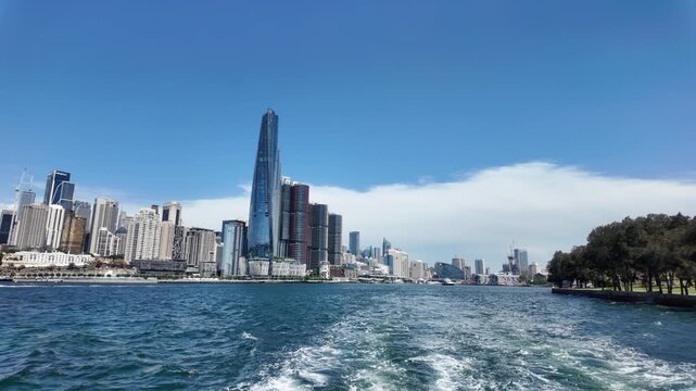 Barangaroo, Sydney's modern waterfront precinct, featuring the prominent Crown Sydney skyscraper and other contemporary buildings along the harbour on a clear day.