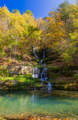 Sunny view of the beautiful autumn landscape of Thunder Falls in Dogwood Canyon Nature Park