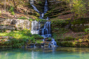Sunny view of the beautiful autumn landscape of Thunder Falls in Dogwood Canyon Nature Park