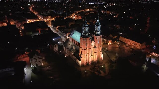 Aerial Gniezno Poland cathedral cityscape night fast. Since 1000 AD, main church of the Gniezno. Basilica of the Assumption of the Blessed Virgin Mary or the Sanctuary of St. Adalbert. 