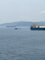 Submarine and escort vessels cross the sea, Strait of Gibraltar, military, strategic, Mediterranean Sea, defence, soldier, marine