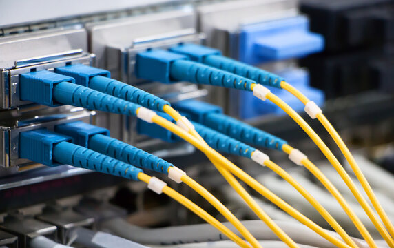 Fiber Optic Cables High-Speed Network Connection in Data Center - Powered by Adobe