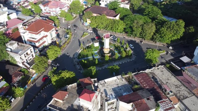 The PKK monument roundabout in Banjarmasin is often busy with city traffic activities