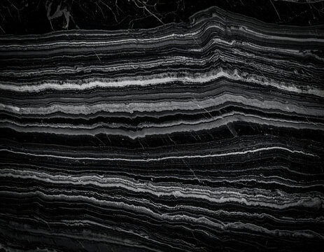 Elegant black marble with striking horizontal white and grey layered veins, perfect for sophisticated backgrounds and luxurious surfaces.