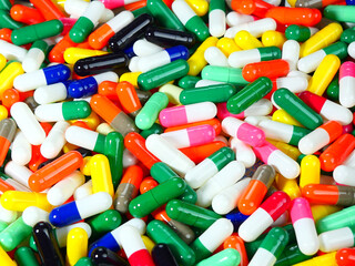 Many multi-colored capsules.