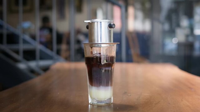 Vietnam drip coffee brewing with bokeh background