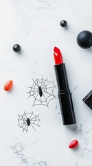 A red lipstick tube is placed on a white marble surface with Halloween-themed spider web decorations and small red and black decorative elements.