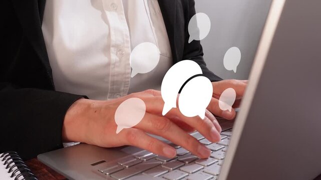 Online chat. Close-up shot of a businesswoman working on her personal computer with speech bubble animation.