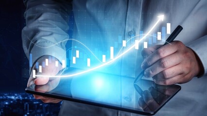 A professional analyzes financial growth on a tablet screen, showcasing graphs and analytics that represent data trends in a modern business environment at night. Copula