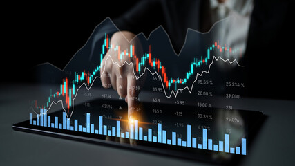 A business professional is closely analyzing financial data on a digital tablet, showcasing stock market graphs and trends for informed investment decisions. Scalp