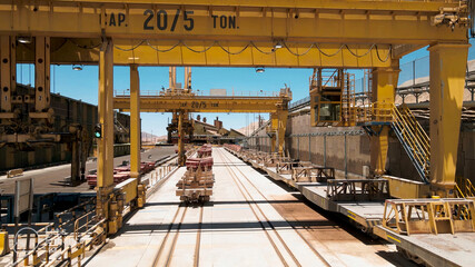 Gantry crane for transporting copper anodes in a mine plant