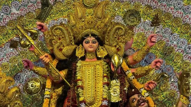 Close-up shot of heavenly Goddess Durga Maa in yellow attire
