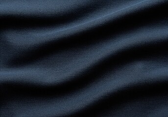 Deep indigo blue twill fabric texture background with wrinkles and heavy folds