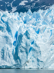 Majestic Perito Moreno Glacier with snow-capped mountains in Patagonia, Argentina. Vivid blue tones...