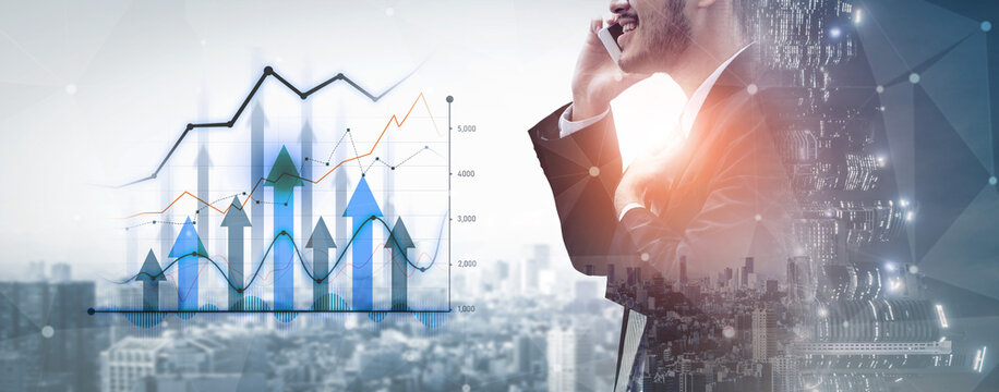 A confident business professional talks on a mobile phone, surrounded by financial charts and a city skyline, symbolizing innovation and strategic growth in a modern environment. Scalp