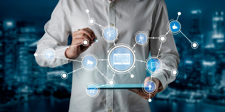 A businessman interacts with a digital tablet, surrounded by social media icons and network connections, illustrating modern technology and communication in a vibrant urban setting. Tessel