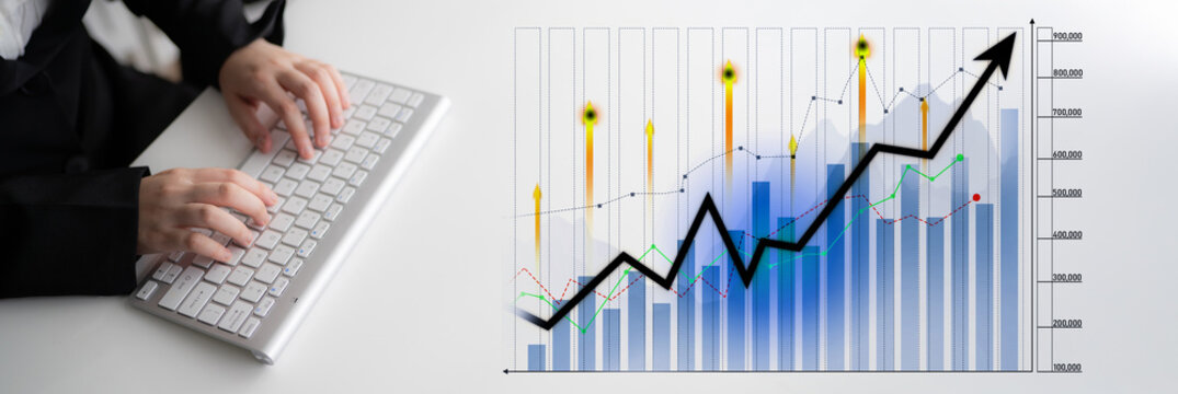 A business professional engages in data analysis using a keyboard while observing a rising graph that symbolizes financial growth and strategic success. Scalp