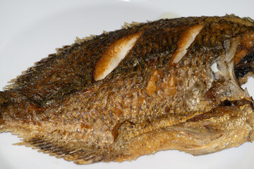 Deep-fried whole fish, golden brown crust