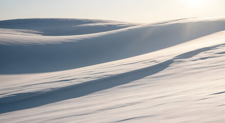 Abstract Snow Dunes with Sunlit Ripples A Serene Winter Landscape Texture