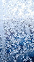 Detailed frosty patterns on a glass window, an abstract winter art background