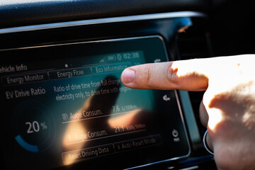 battery energy and petrol consumption data screen on hybrid vehicle