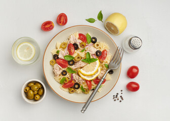 Tuna Pasta Salad on grey background, top view