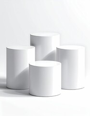 Cylindrical white podiums, varying heights, clean backdrop