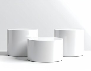 Three white cylinders, varying heights, on a white surface