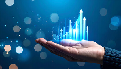 Blue background with hand supporting rising bars and arrows showing profit increase and business performance.