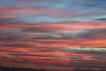 Fiery Horizon A Sky Ablaze with Sunset Hues. Pink and Blue Clouds