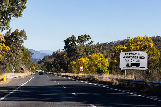 Emergency arrester bed on left sign for trucks on highway road