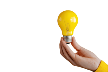 Hand holding a bright yellow incandescent light bulb against a black background image